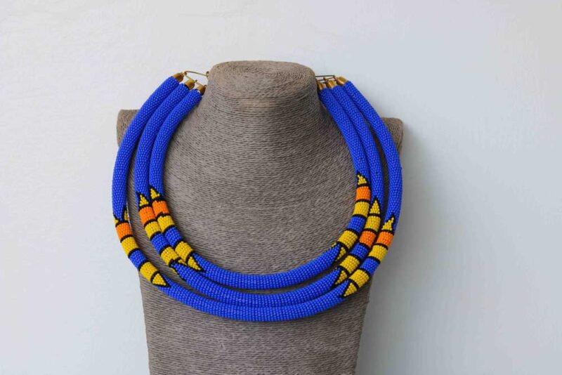REHEMA Blue Beaded Necklace is made using glass beads and thread.