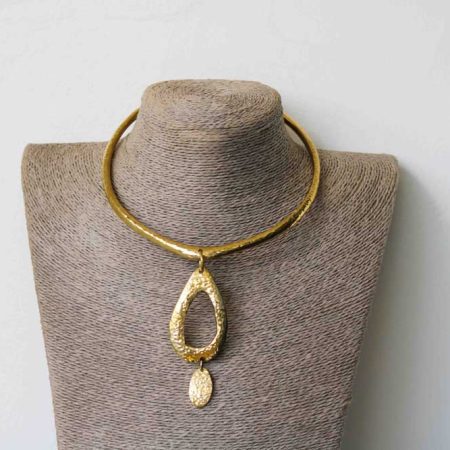 This African brass pendant necklace compliments any outfit