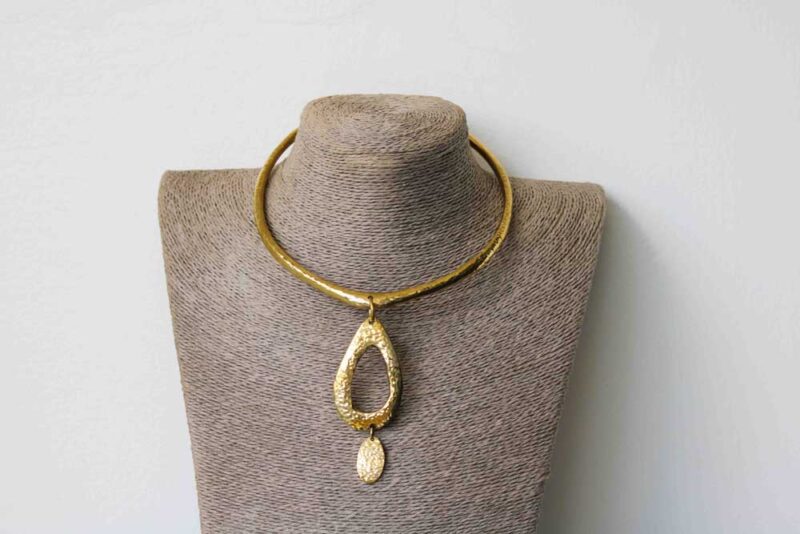 This African brass pendant necklace compliments any outfit